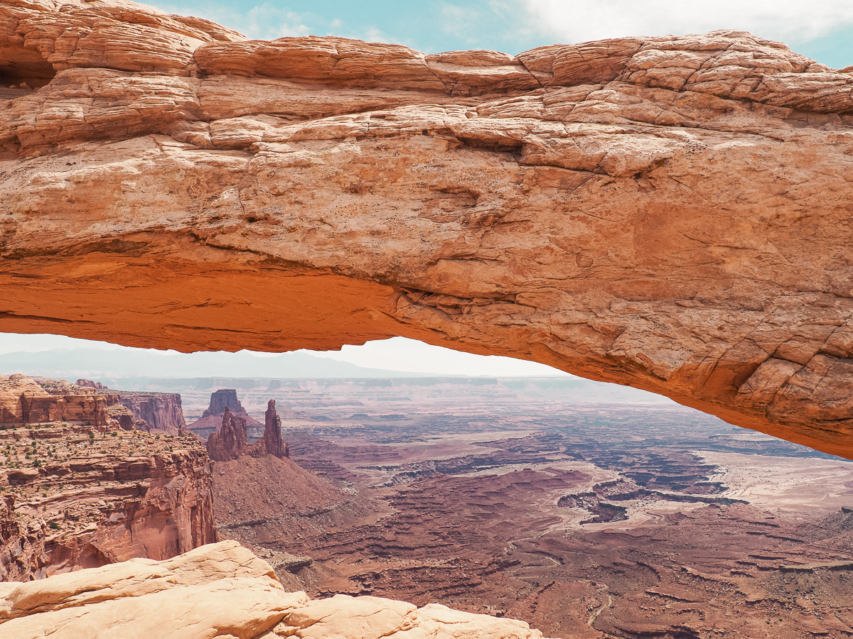Mesa Arch in and the surrounding desert landscape of Islands in the sky