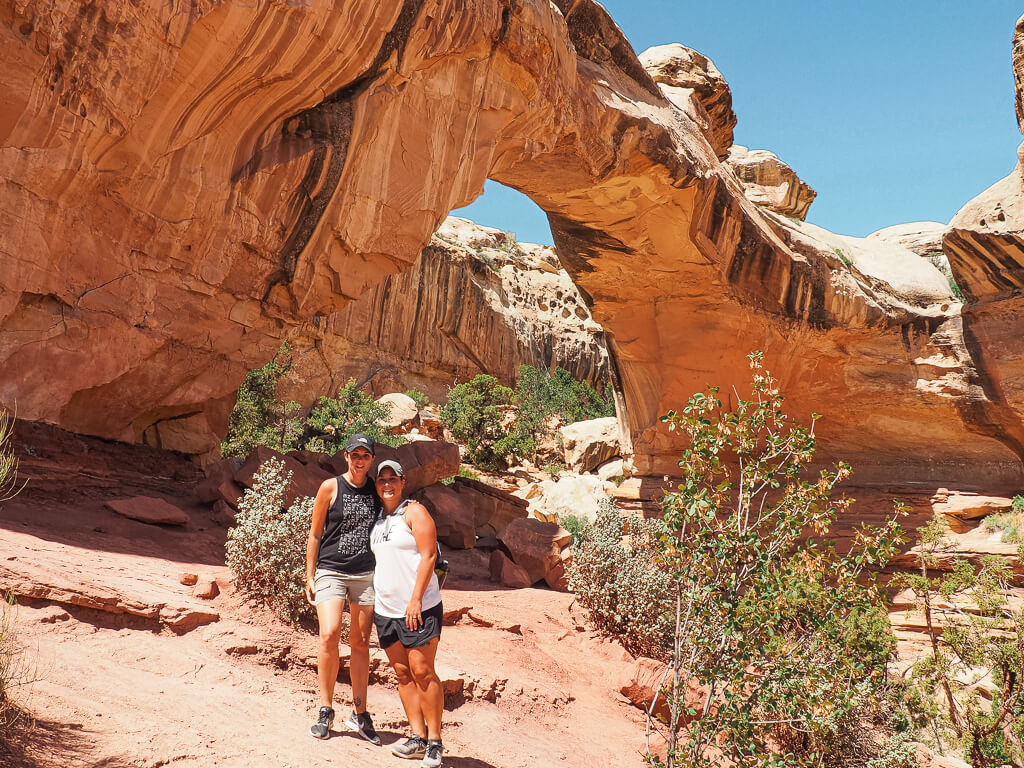 Us standing in front of the Hickman Bridge in Capitol Reef National Park