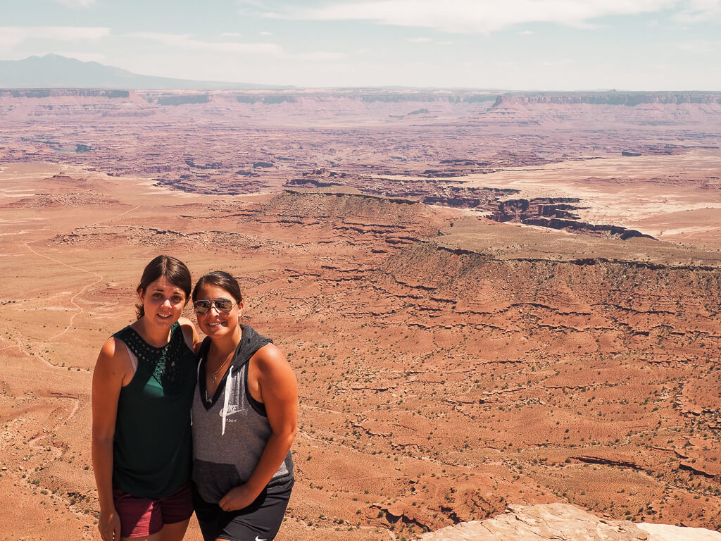 Us standing in front of the vast landscape in Island in the Sky Canyonlands