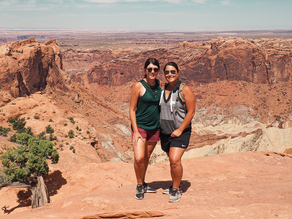 Us standing on the edge of the Upheaval Dome, a crater in Island in the Sky Canyonlands