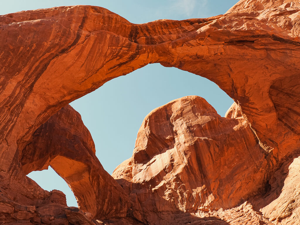 See both of the arches of the Double Arch when you get close up