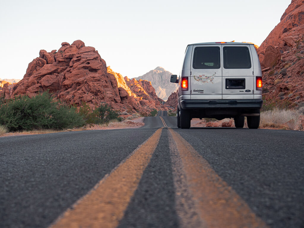 Our van driving between red rocks in Valley of Fire State Park Nevada