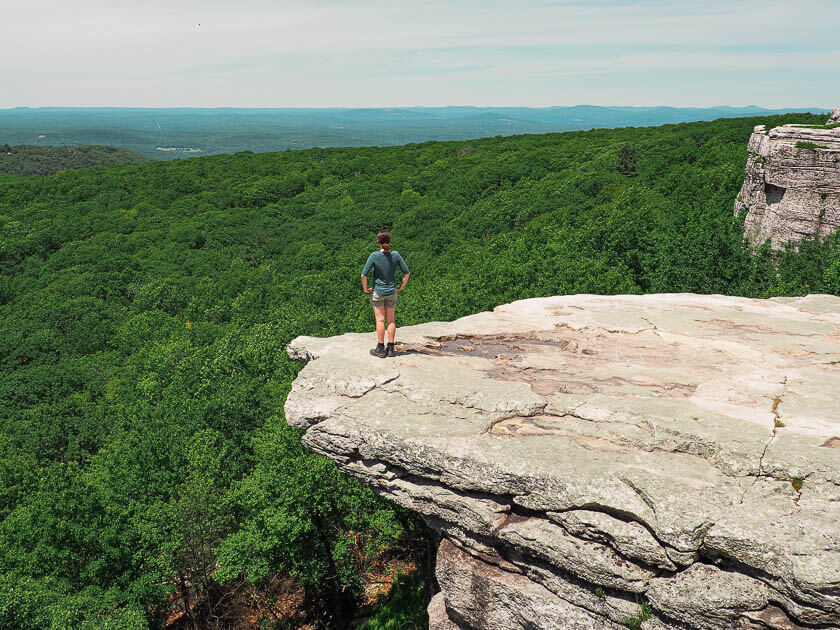 Dana standing on a ledge in Sam's Point Area of Minnewaska State Park