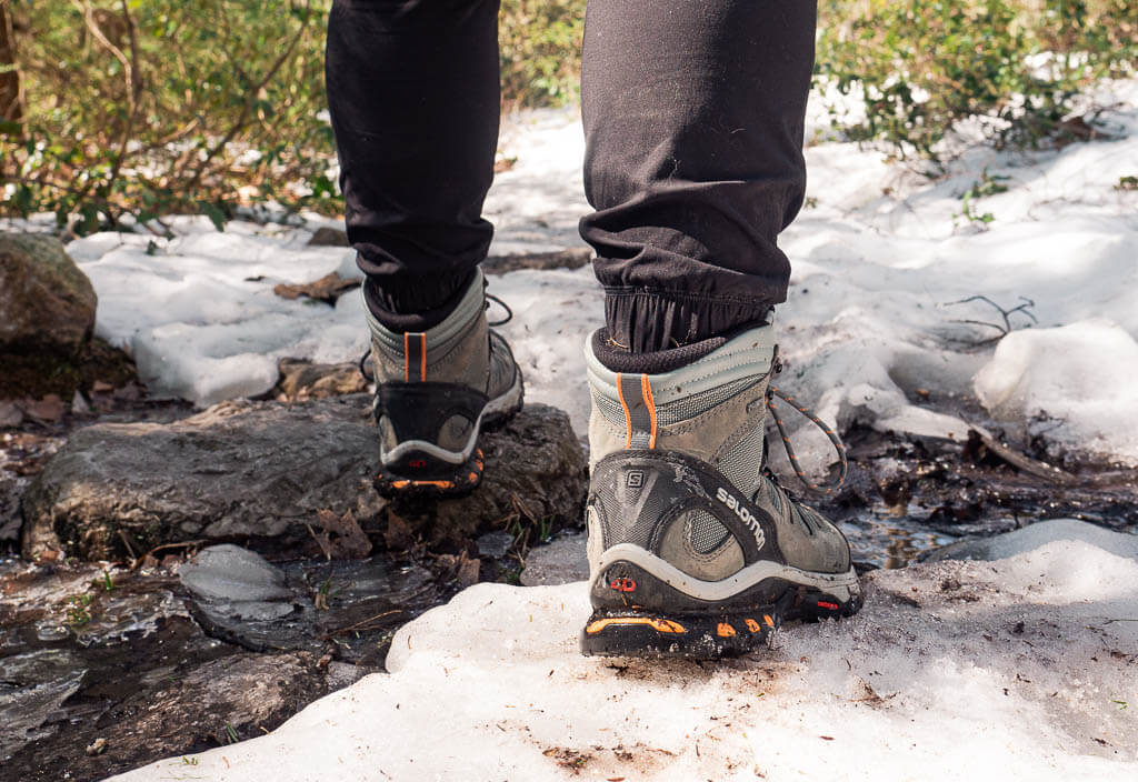 Rachel's winter boots on an icy surface in Minnewaska State Park