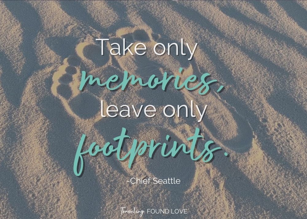 Short travel quote with footprints in the sand in the background